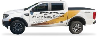 White pickup truck with Atlanta Metro Roofing company branding and phone number