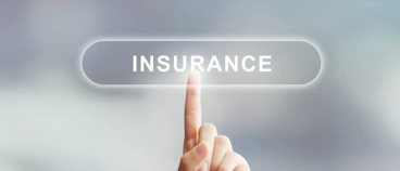 Hand pointing to insurance button on digital interface for protection services