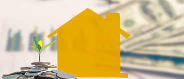 Yellow paper house model with coins and plant sprout on financial documents