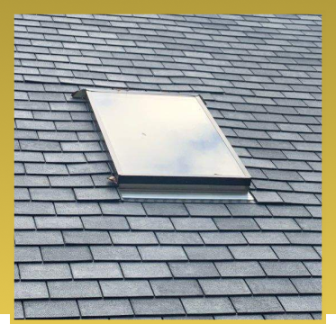 Solar panel installed on gray slate shingle roof for renewable energy generation